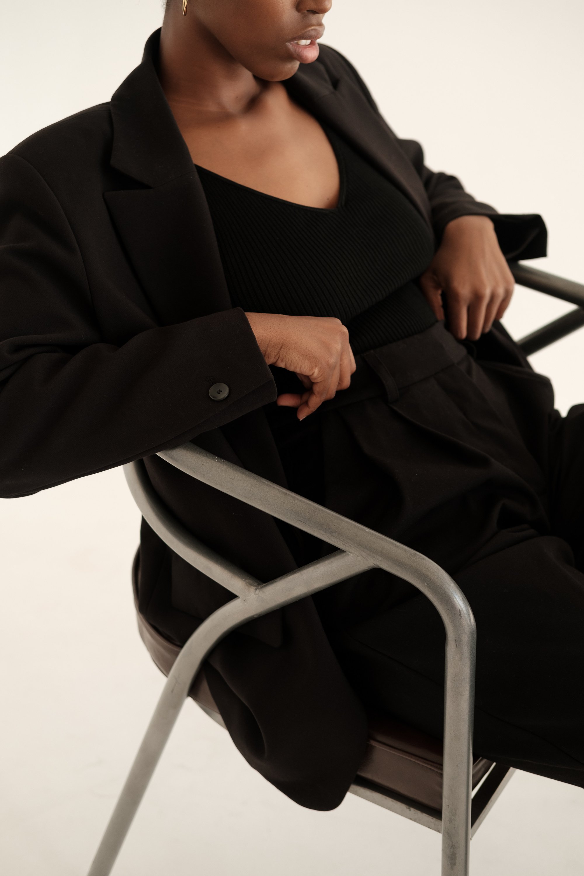 Woman in Black Blazer and Crop Top